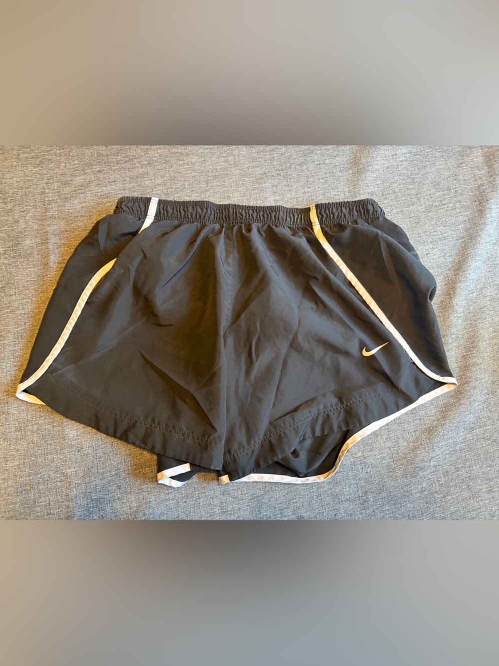Nike Black Shorts with White Trim and Gold Swoosh